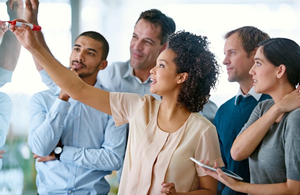 A woman presenter shares her insights to create career opportunities within her organization.